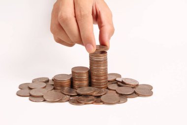 Bir elinde büyüyen para sikke yığını