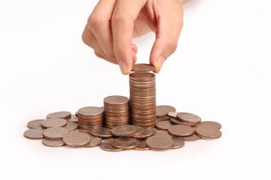 Bir elinde büyüyen para sikke yığını