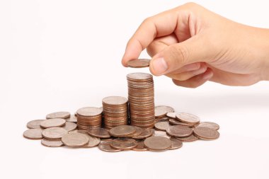 Bir elinde büyüyen para sikke yığını