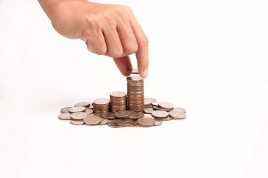 Bir elinde büyüyen para sikke yığını