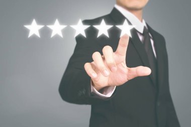Hand touching five star symbol to increase rating  clipart