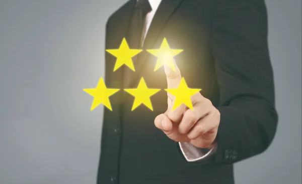 Hand touching five star symbol to increase rating — Stock Photo, Image