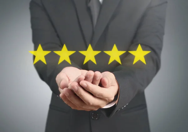 Hand touching five star symbol to increase rating — Stock Photo, Image