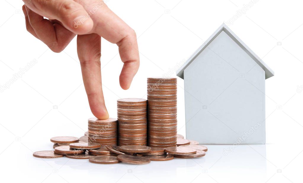 Hand choosing row of coin  house Planning to buy property