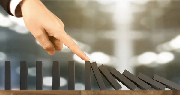 Hand stopping  Domino effect stopped by unique — Stock Photo, Image