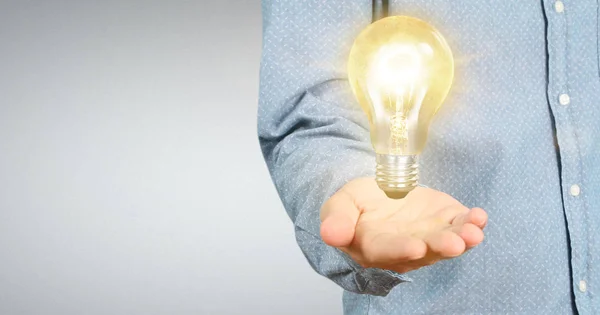 Hand of holding illuminated light bulb, innovation inspiration c — Stock Photo, Image