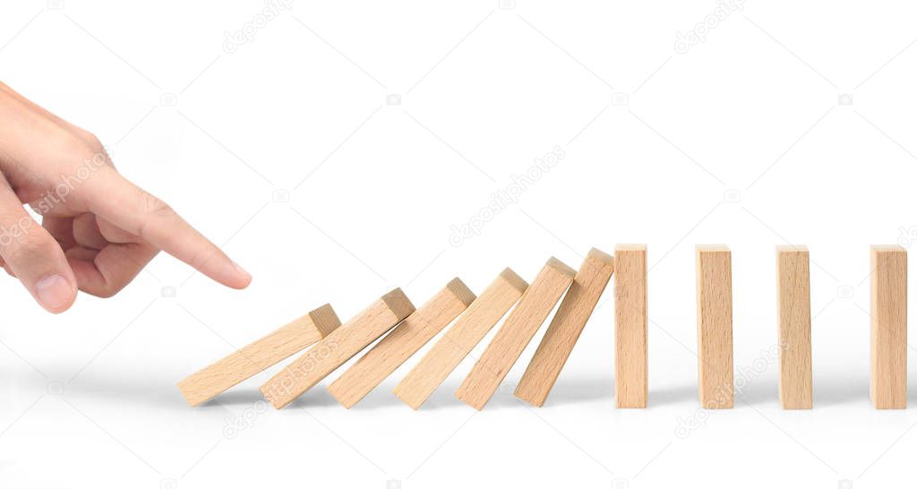 Hand stopping the Domino effect stopped by unique