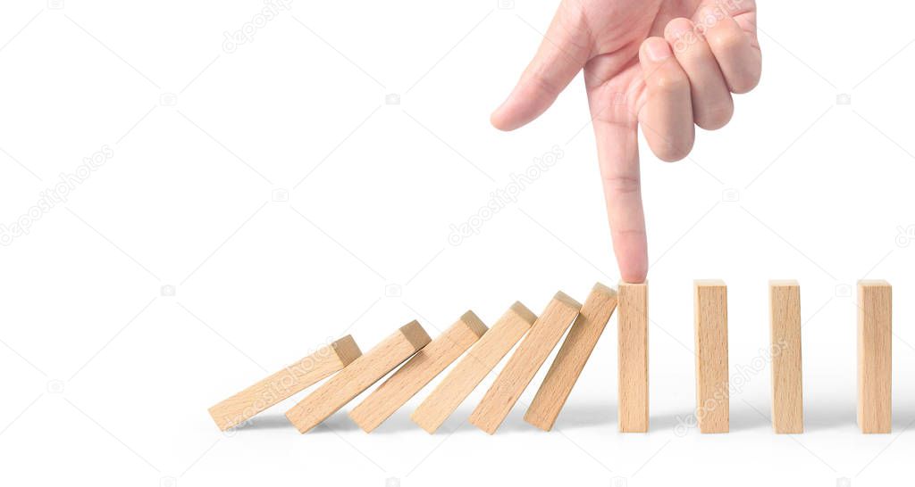 Hand stopping the Domino effect stopped by unique
