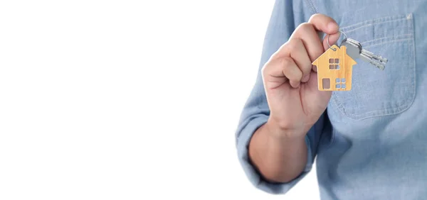 Real estate agent handing over house keys in hand — Stock Photo, Image