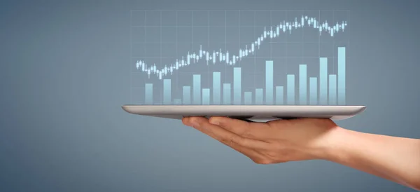 Graph growth and increase of chart positive indicators in his business, tablet in a hand