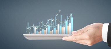 Grafik büyümesi ve grafiğin artması onun işinde olumlu göstergeler, elinde tablet
