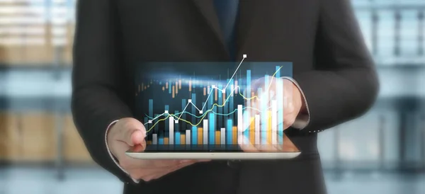 Business plan graph growth and increase of chart positive indicators in his business, tablet in hand