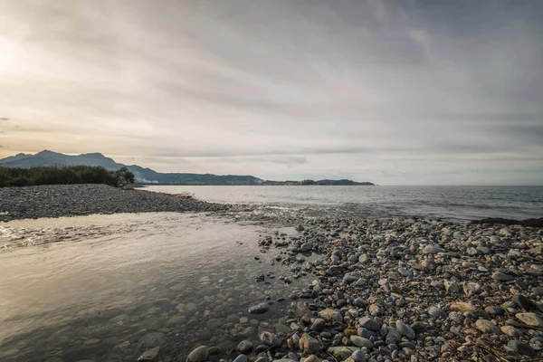 Shallow River Joins Mediterranean Sea Pebble Beach Corsica Citadel Calvi — Stock Photo, Image