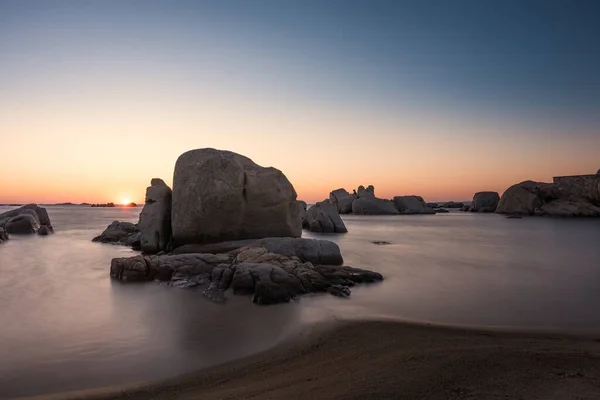 Sunrise over boulders at Cavallo Island in Corsica — Stock Photo, Image