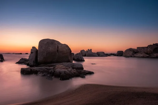 Sunrise over boulders at Cavallo Island in Corsica — Stock Photo, Image