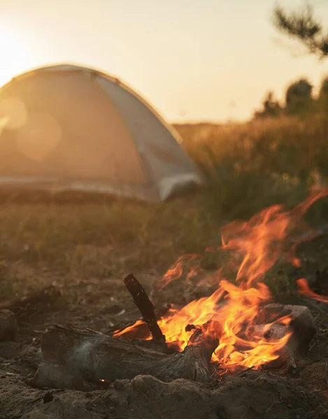 campfire in front of tent. weekend out of a town. warm place