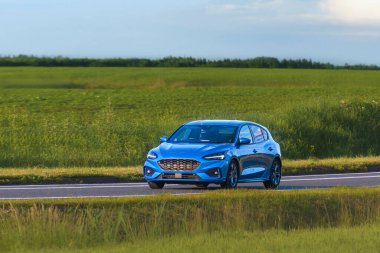 Modern estate car cruising on scenic highway