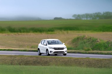 Front view of hatchback on summer drive