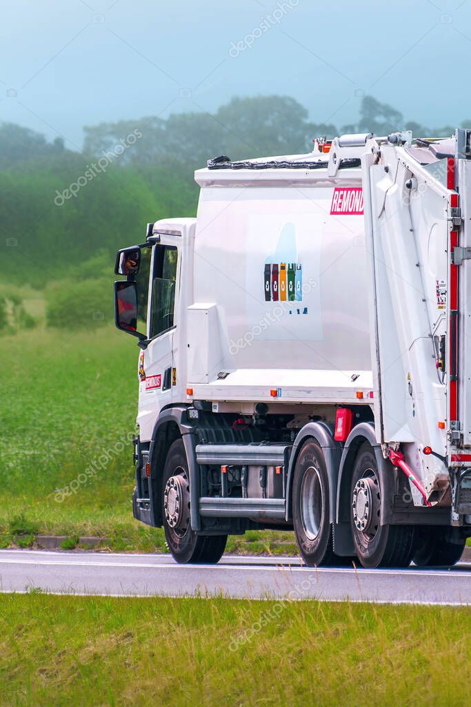 Remondis brand garbage truck traveling on asphalt road 12.08.2025 Poland Europe