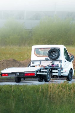 Utility truck parked near dirt construction site