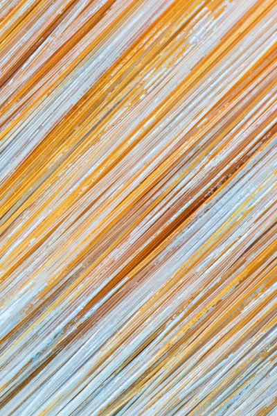 Dried paint on paintbrush bristles in extreme macro view creating interesting abstract texture