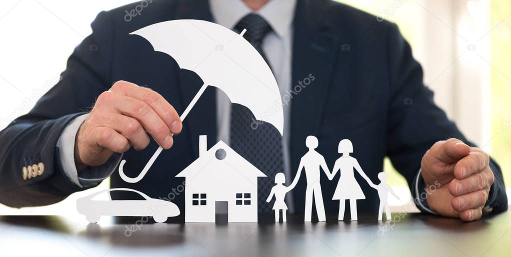 General agent protecting a family, a house and a car with his hands