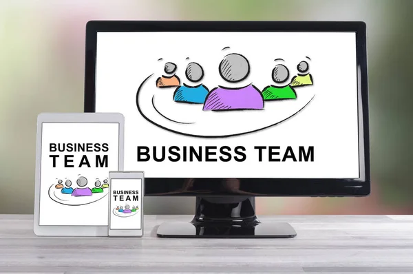 Business team concept shown on different information technology devices