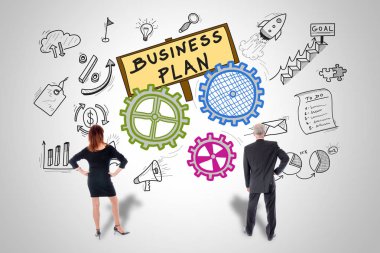 İş planı kavramı iş kişi tarafından izlenen bir duvara çizilen