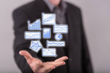 Veri analiz kavramı içinde geçmiş bir adamın elini yukarıda