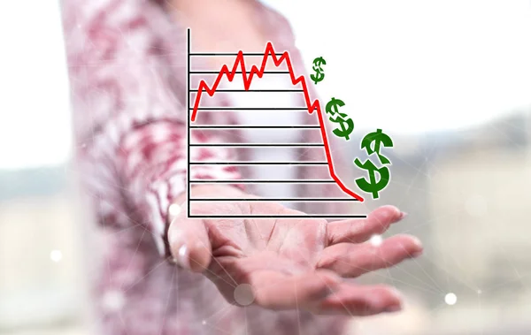 Stock market crash concept above the hand of a woman in background