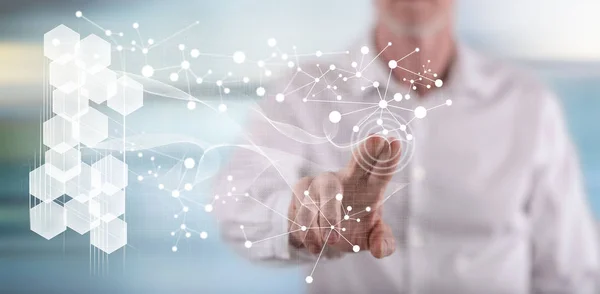 Man touching a virtual network on a touch screen with his finger