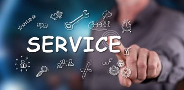 Bir adam dokunmatik ekranda bir servis konseptine parmağıyla dokunuyor.