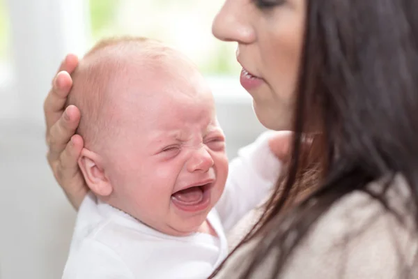 Mother Soothing Her Crying Baby — Stock Photo, Image