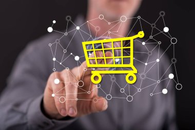 Adam dokunmatik ekranda bir e-ticaret konseptine parmağıyla dokunuyor.