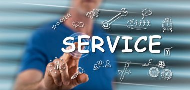 Bir adam dokunmatik ekranda bir servis konseptine parmağıyla dokunuyor.