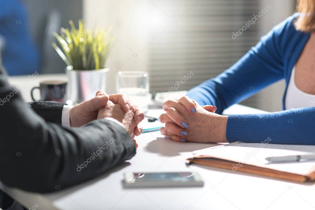 Situation of business negotiation between businesswoman and businessman, light effect