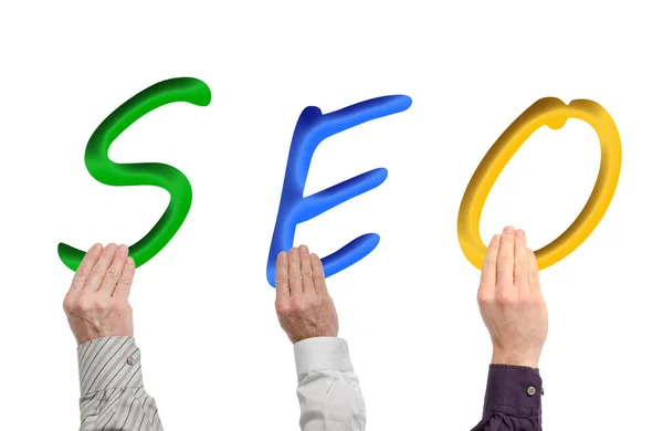 Buchstaben Des Wortes Seo Mit Den Händen Gehalten Isoliert Auf — Stockfoto