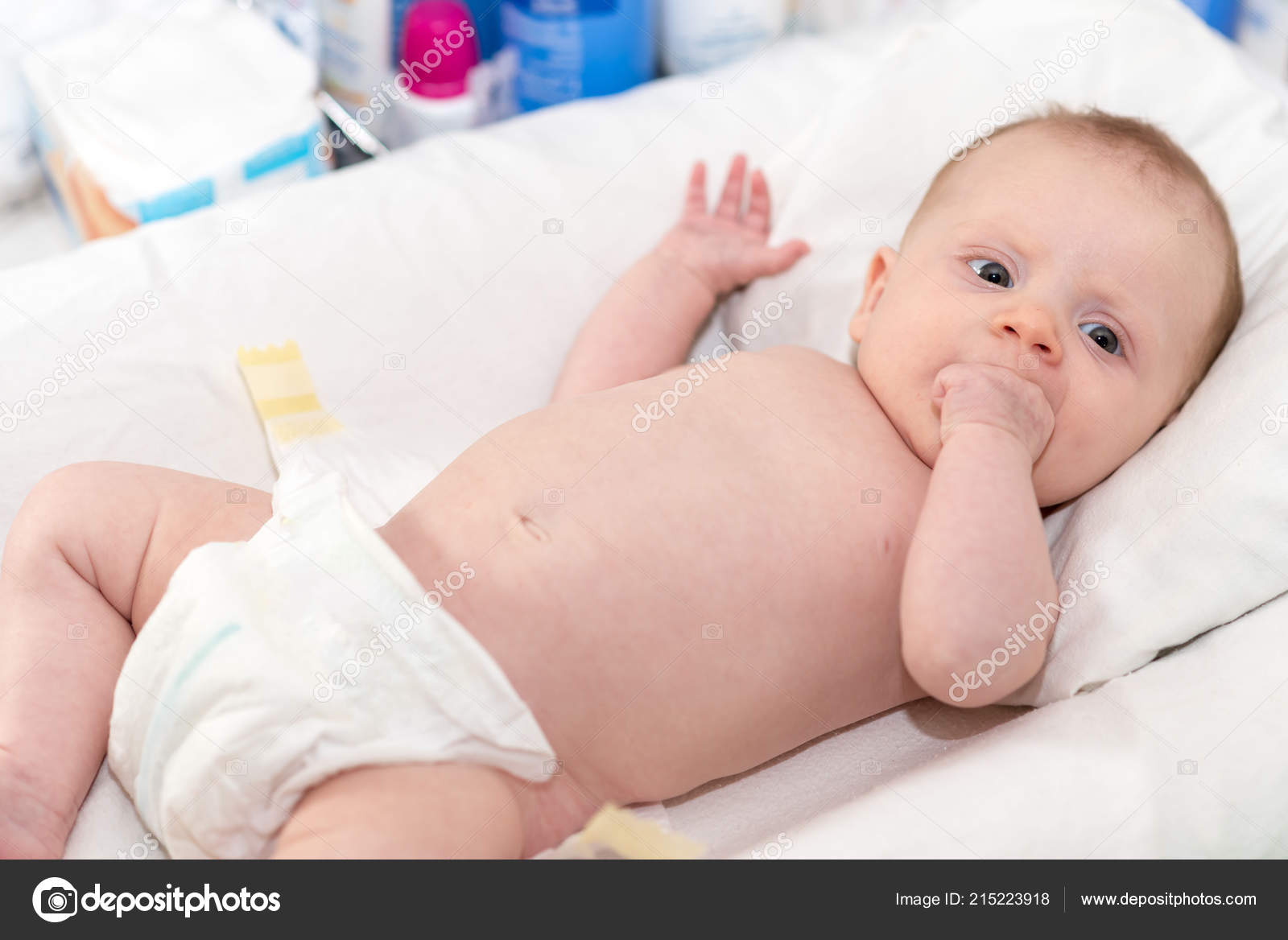 baby on changing table