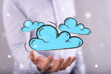 Bulut ağı kavramı arka plandaki adamın elinin üstünde.