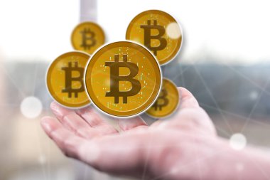 Bitcoin konsepti bir adamın elinin üstünde.