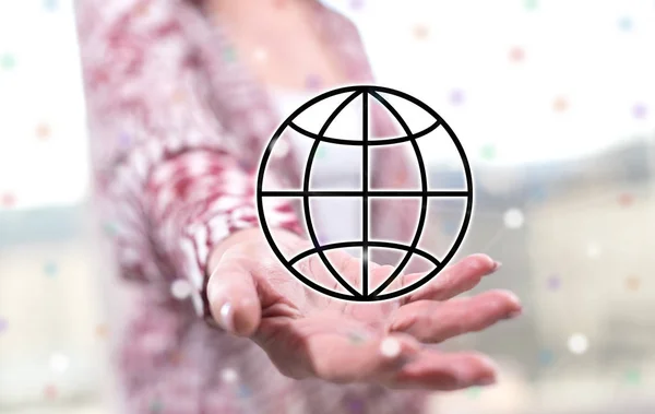 Global business concept above the hand of a woman in background