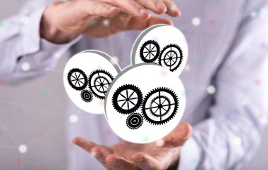 Arka plandaki bir adamın elleri arasındaki takım çalışması kavramı