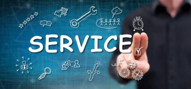 Bir adam dokunmatik ekranda parmaklarıyla servis kavramına dokunuyor.