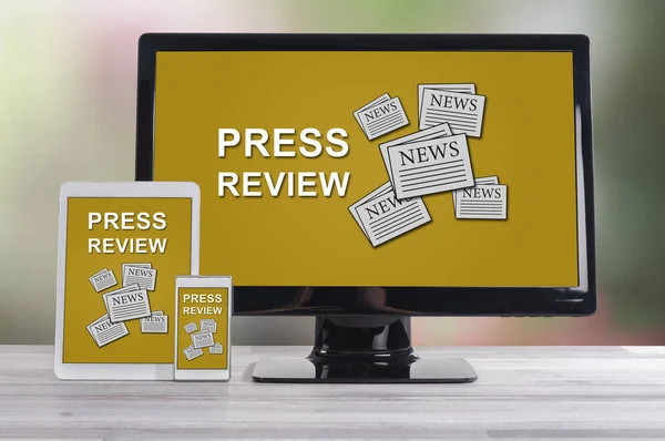 Press review concept shown on different information technology devices