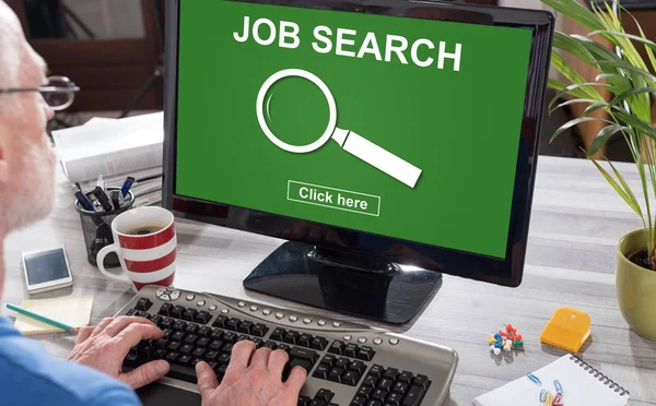 Man using a computer with job search concept on the screen