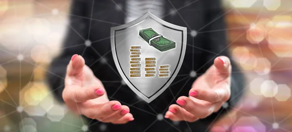 Money protection concept above the hands of a woman in background