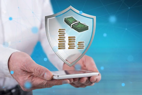 Money protection concept above a smartphone held by hands