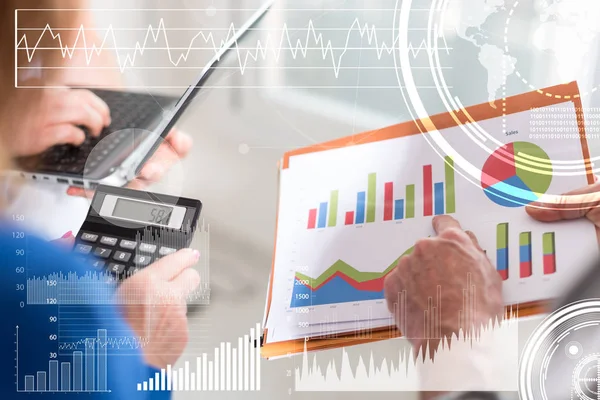 Business people discussing about financial results in office, overlayed with charts