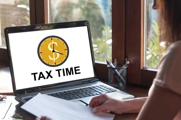 Laptop screen displaying a tax time concept