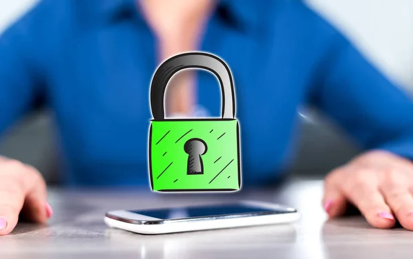 Smartphone with data security concept between hands of a woman in background